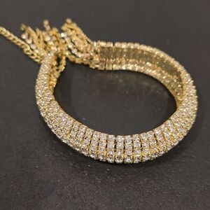 Rhinestone gold tone tassel bracelet